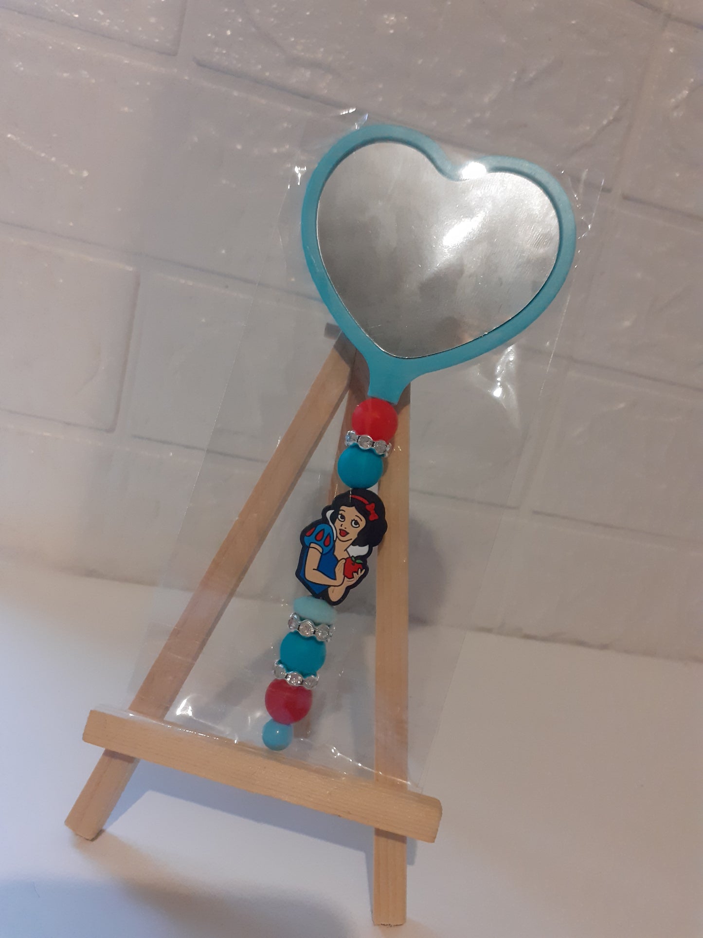 Beaded heart shaped mirror