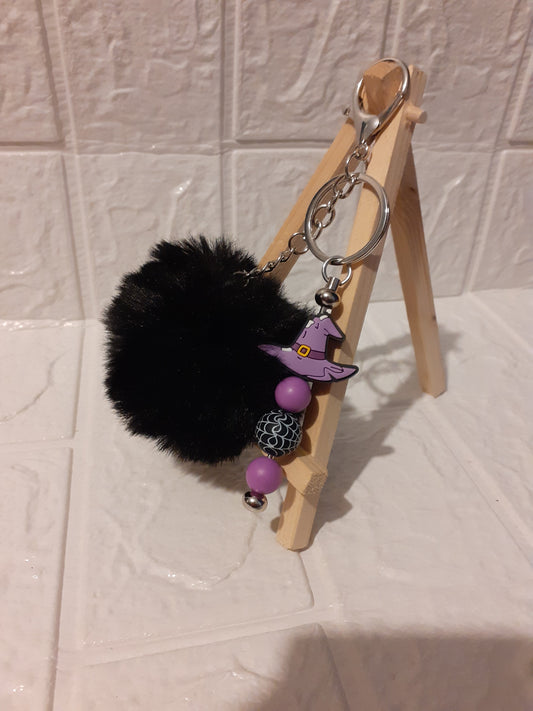 silver witch hat keychain with black pom pom