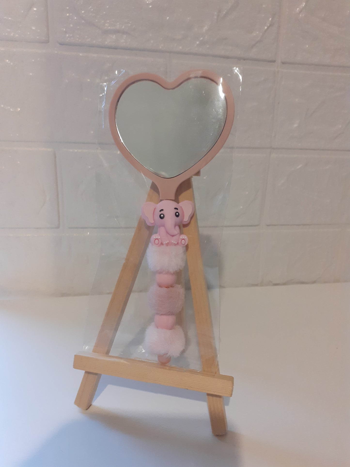 Beaded heart shaped mirror